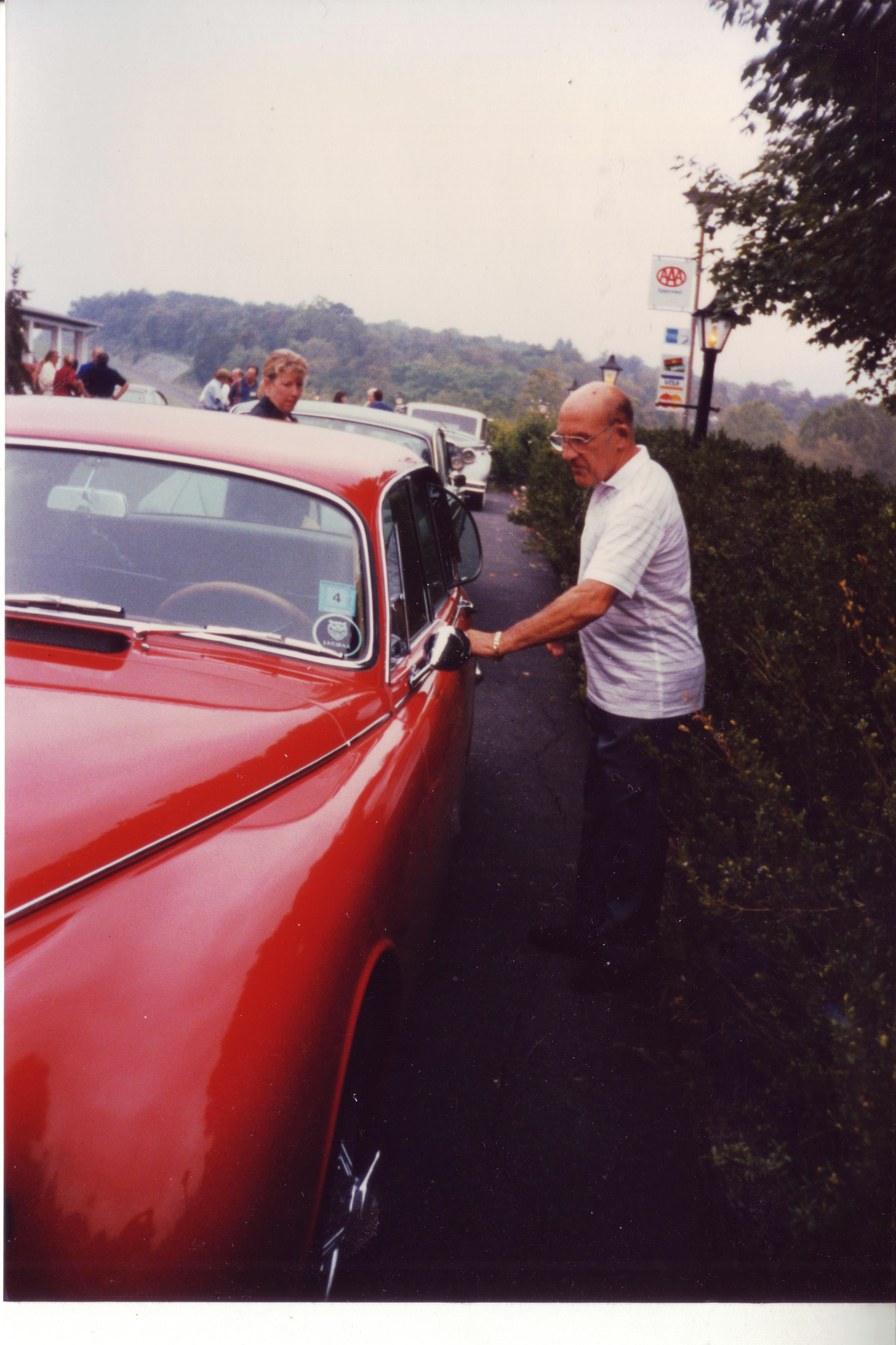 3 Stirling Moss getting into driver's seat of P1B79909DN.JPG