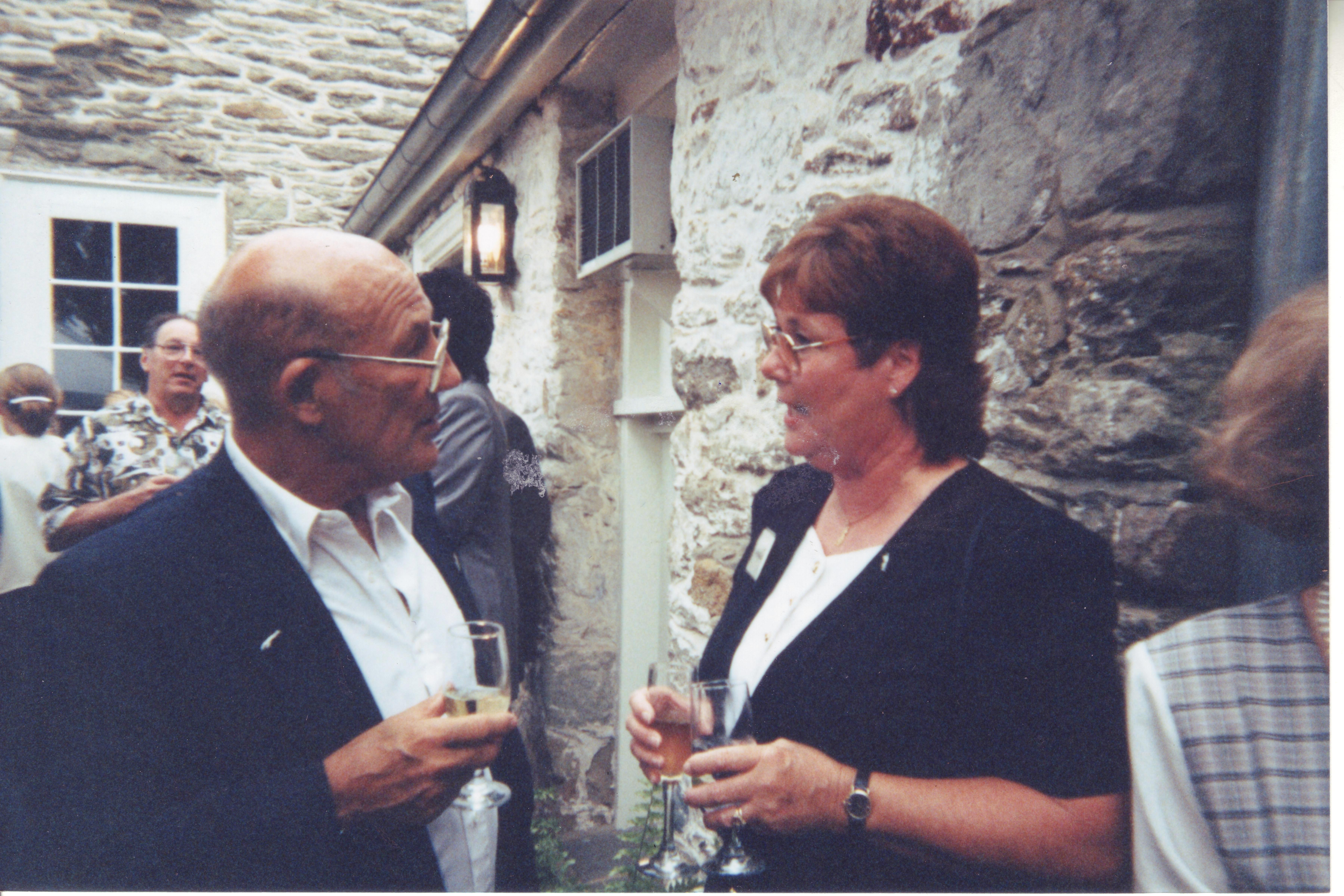 1 Stirling Moss & Patricia chatting over cocktails.JPG